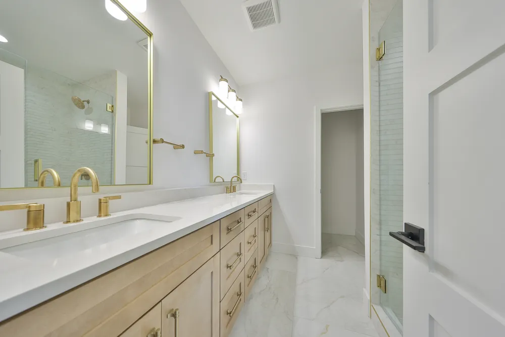 Primary bathroom at 1206 W Lemon with a double vanity and walk-in shower