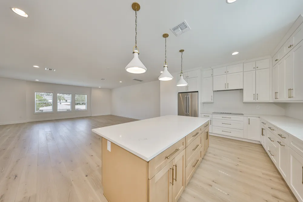 Kitchen at 1206 W Lemon with a large quartz island and pendant lighting