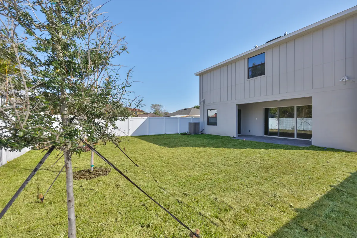 Oversized fenced backyard with room for a pool behind the South Tampa new construction home