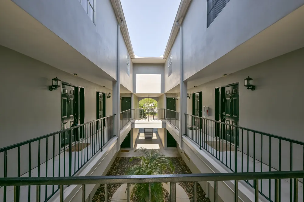 A shared breezeway between buildings, a common element the dues maintain