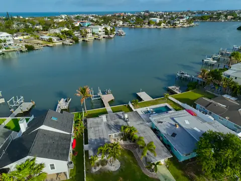 Lower aerial of the property and its private dock on a protected Intracoastal cove.