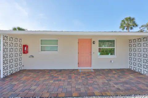 Iconic breeze-block pattern detail that defines the compound's mid-century character.