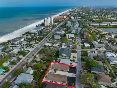 Overhead aerial of the compound outlined in red, steps from the Gulf beach and Intracoastal.