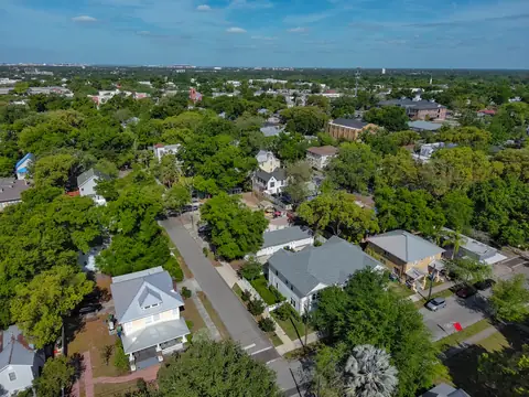 Aerial view of the townhome in its tree-lined Tampa Heights neighborhood.