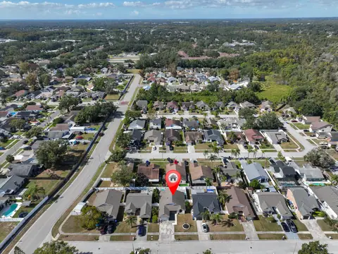 High aerial showing the property's position within the subdivision near community parks.