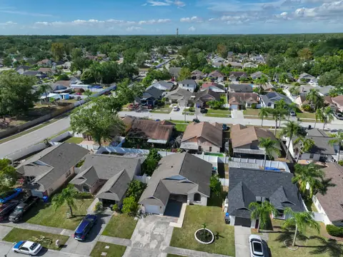 Lower aerial showing the home's well-kept block and immediate surroundings.