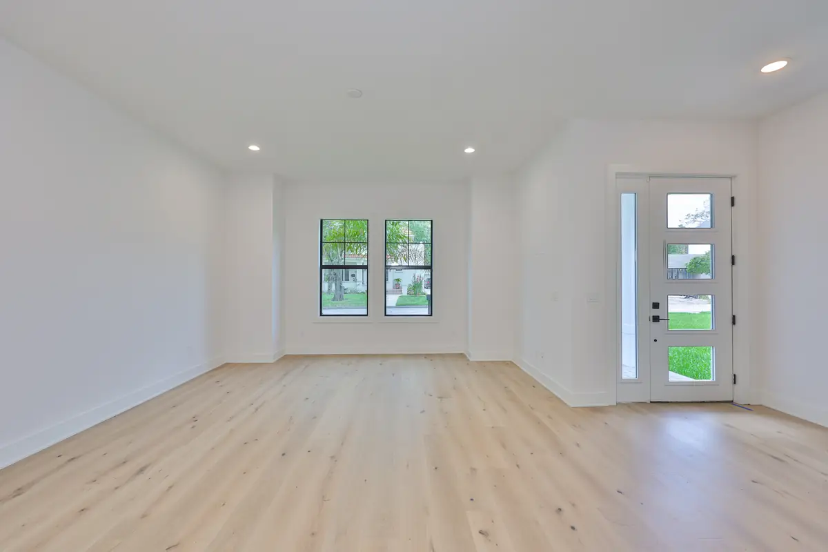 Bright modern farmhouse living area with wide-plank oak floors