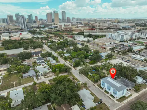 Aerial view of the townhomes with the downtown Tampa skyline in the background.