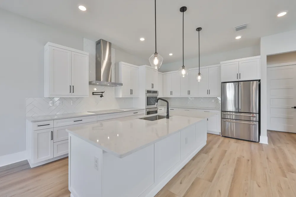 Kitchen with island and stainless appliances in a new South Tampa build